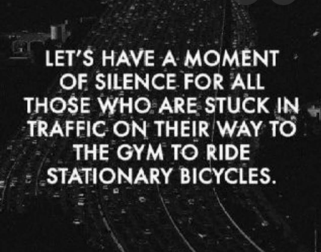 A humorous quote about traffic and gym stationary bikes.