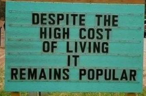 A sign humorously commenting on the high cost of living.